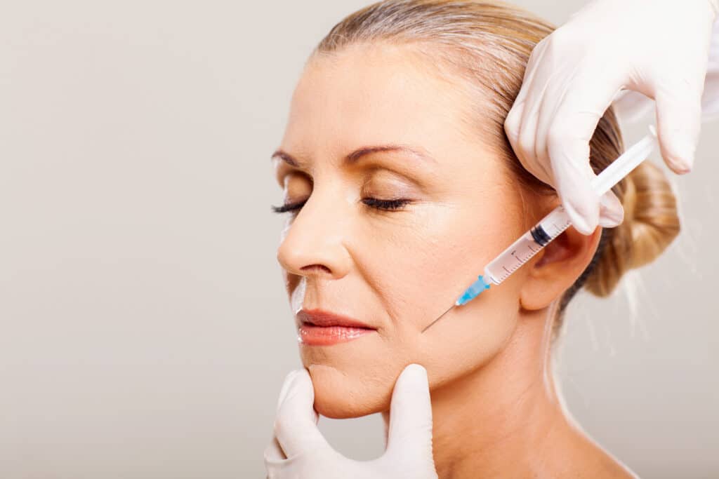senior woman doing face lifting